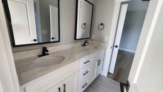 bathroom featuring vanity and wood-type flooring