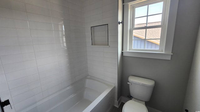 bathroom featuring shower / bath combination and toilet