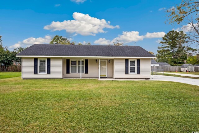 single story home with covered porch and a front yard