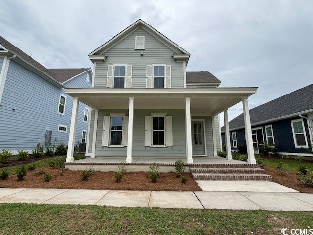 country-style home featuring covered porch