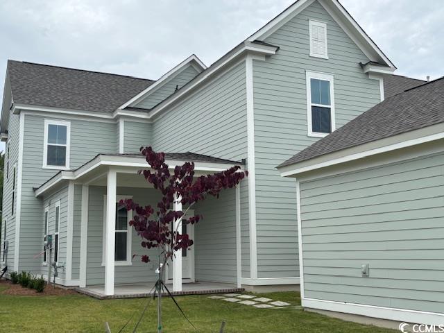 718 Macon Aly, Myrtle Beach, SC 29588 - rear view of property with a lawn and a shingled roof