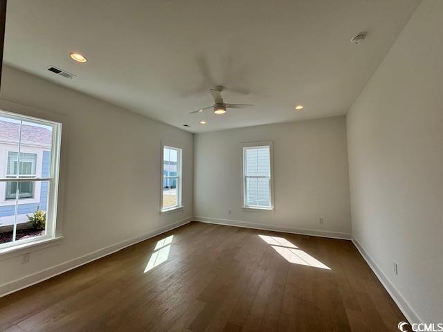 unfurnished room with dark wood-style flooring, ceiling fan, baseboards, and recessed lighting