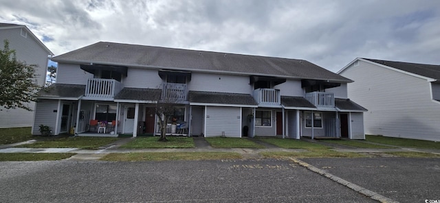 view of property with a balcony