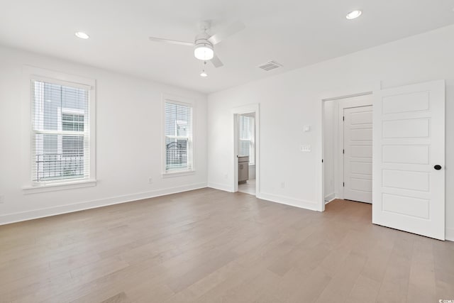 unfurnished bedroom featuring light wood finished floors, baseboards, visible vents, and recessed lighting