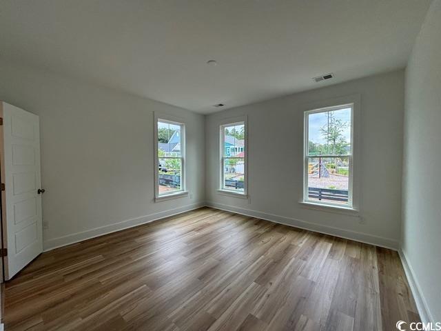 734 Macon Aly, Myrtle Beach, SC 29588 - spare room with wood finished floors and baseboards
