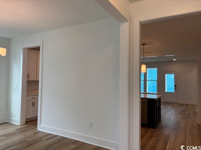 734 Macon Aly, Myrtle Beach, SC 29588 - empty room featuring dark wood finished floors and baseboards