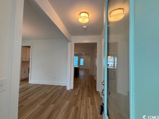 734 Macon Aly, Myrtle Beach, SC 29588 - hall featuring wood finished floors and baseboards