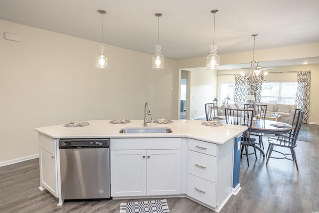 kitchen featuring white cabinets, a center island with sink, stainless steel dishwasher, and sink