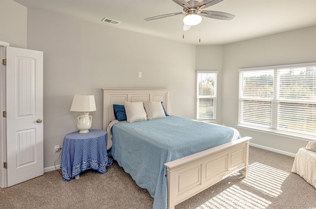 bedroom with light colored carpet and ceiling fan