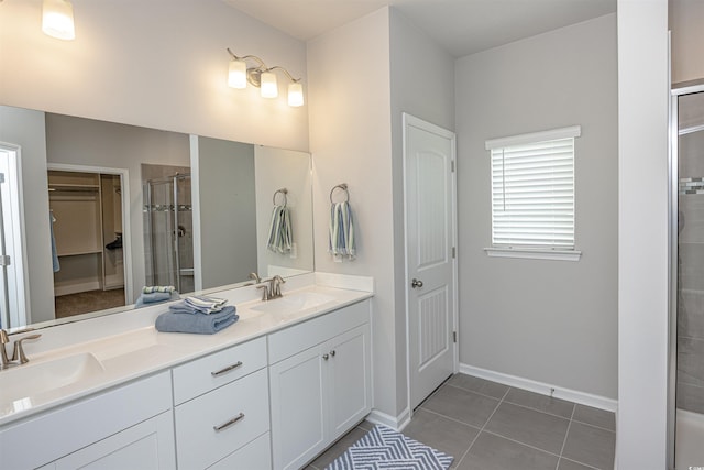 bathroom with tile patterned flooring, vanity, and an enclosed shower