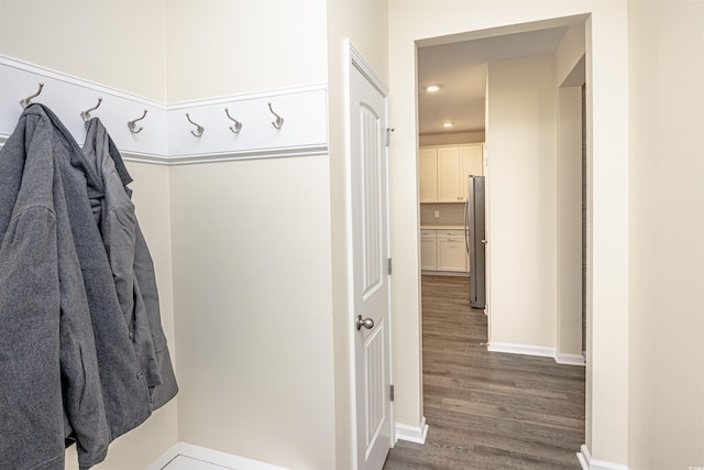 mudroom with dark hardwood / wood-style floors