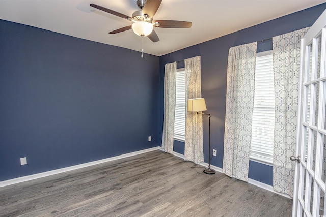 empty room featuring hardwood / wood-style floors and ceiling fan