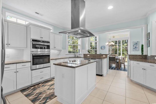5012 Lindrick Ct, Myrtle Beach, SC 29579 - kitchen featuring stainless steel appliances, island exhaust hood, a notable chandelier, and ornamental molding