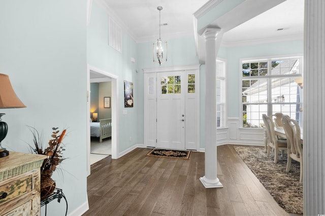 5012 Lindrick Ct, Myrtle Beach, SC 29579 - entryway featuring crown molding, a healthy amount of sunlight, dark wood-style floors, and ornate columns