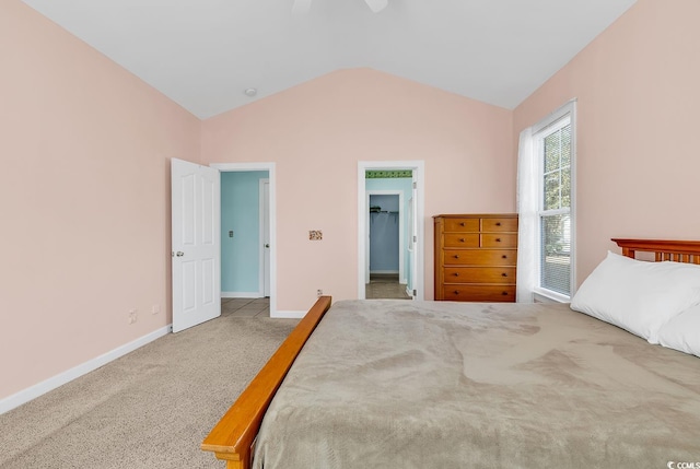 bedroom featuring ceiling fan, carpet floors, and lofted ceiling