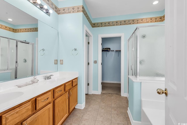 bathroom with vanity, tile patterned floors, and walk in shower