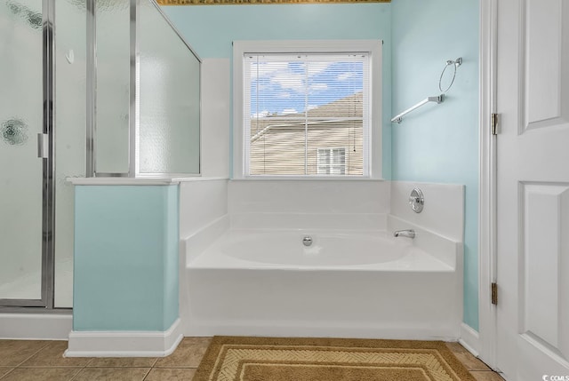 bathroom featuring tile patterned flooring and plus walk in shower