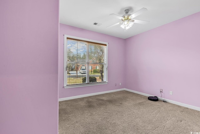 empty room with carpet flooring and ceiling fan