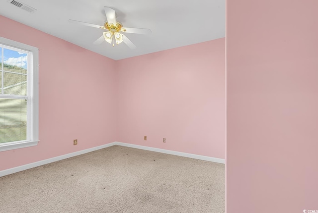 empty room featuring carpet and ceiling fan