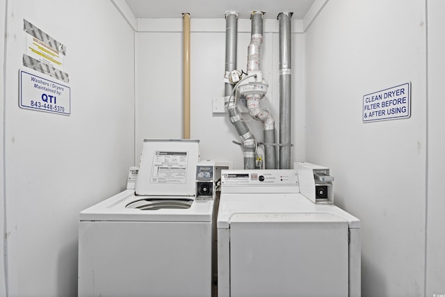 laundry area featuring washing machine and clothes dryer