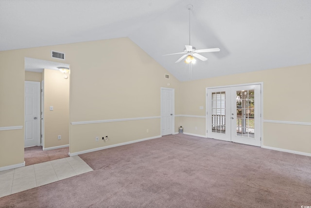 unfurnished room featuring light carpet, french doors, ceiling fan, and high vaulted ceiling