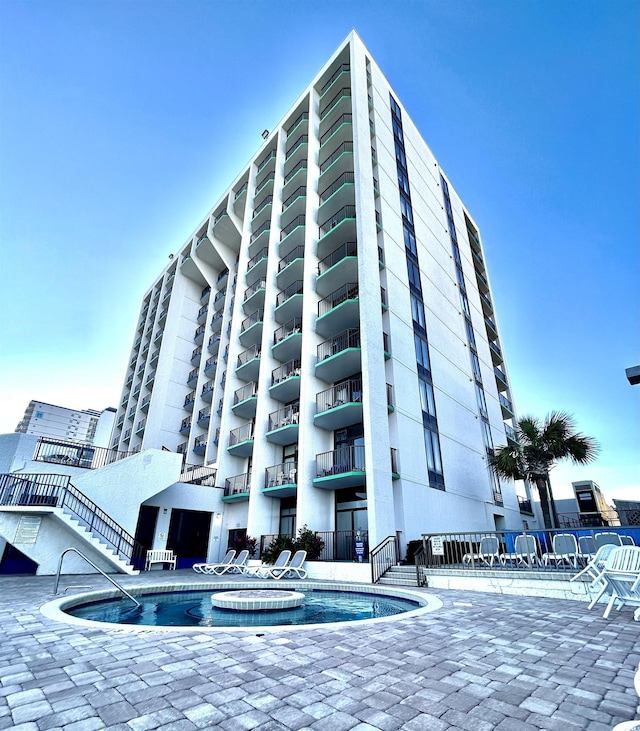 view of property featuring a community pool