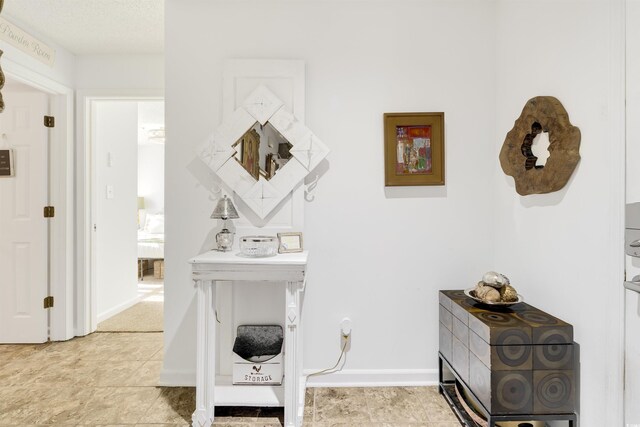 hallway with light tile patterned floors