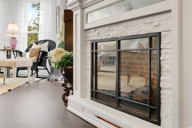 interior details featuring a stone fireplace