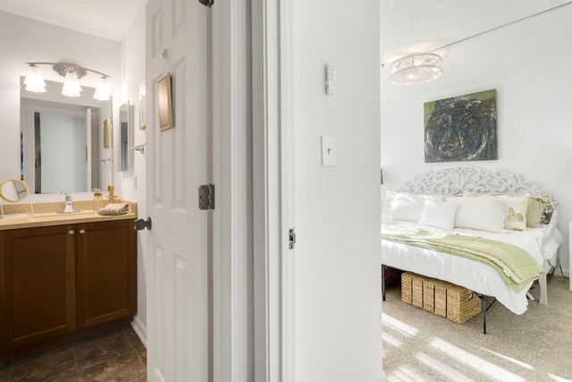 bathroom with hardwood / wood-style floors, vanity, a textured ceiling, and tiled shower / bath combo