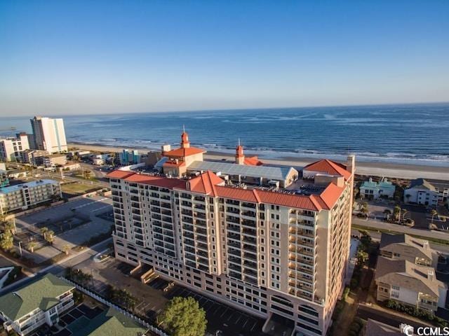 aerial view featuring a water view and a beach view