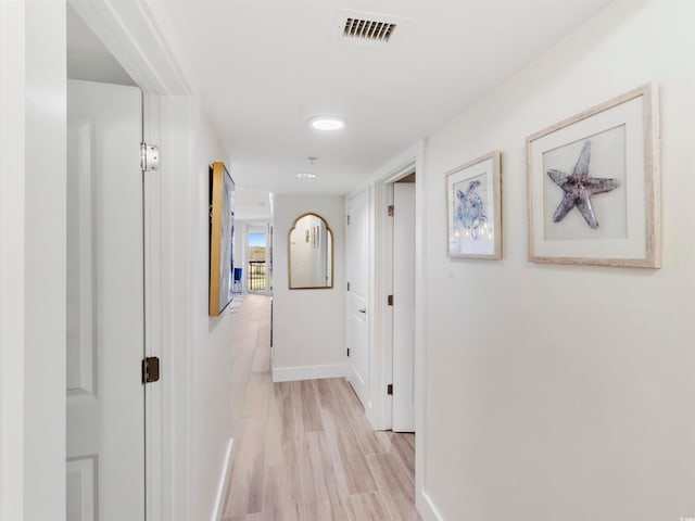 hall with light hardwood / wood-style floors