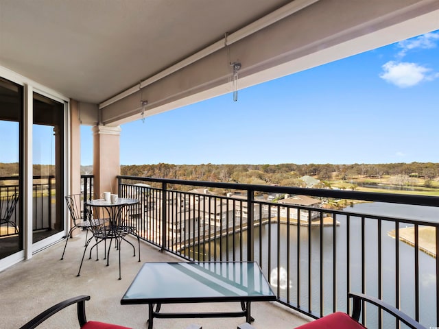 balcony featuring a water view