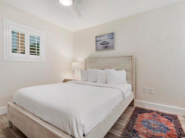 bedroom featuring hardwood / wood-style flooring and ceiling fan