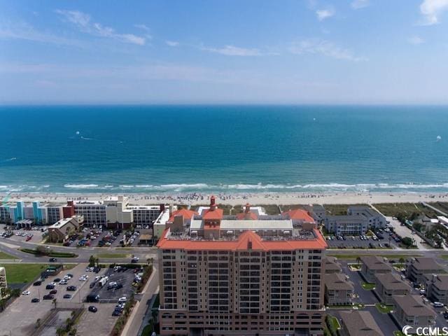 birds eye view of property featuring a water view and a view of the beach