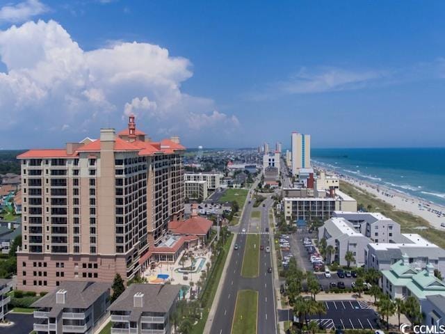 aerial view featuring a water view and a beach view