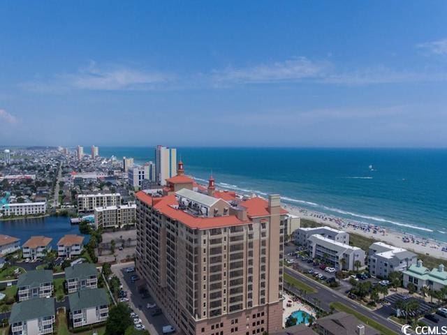 aerial view with a view of the beach and a water view