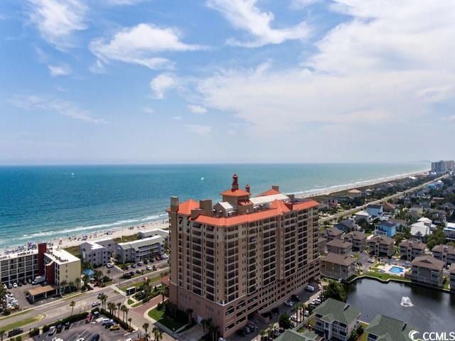 aerial view with a view of the beach and a water view