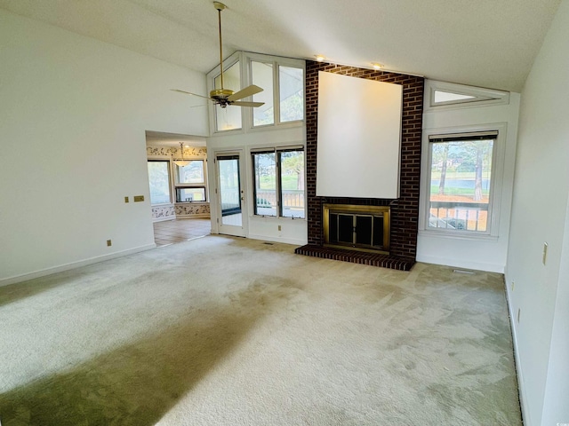 unfurnished living room featuring baseboards, a ceiling fan, carpet floors, a brick fireplace, and high vaulted ceiling