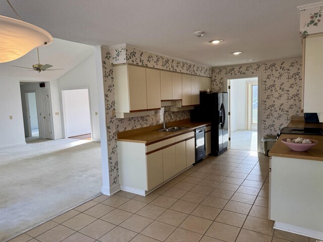 unfurnished living room featuring light carpet, high vaulted ceiling, a brick fireplace, and ceiling fan