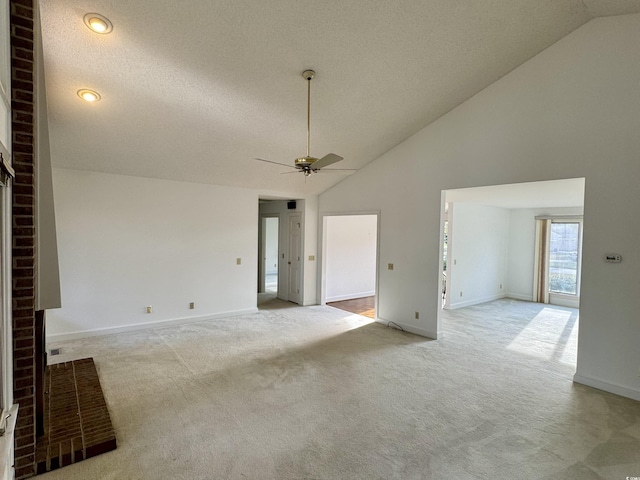 interior space featuring light carpet, ceiling fan, and baseboards