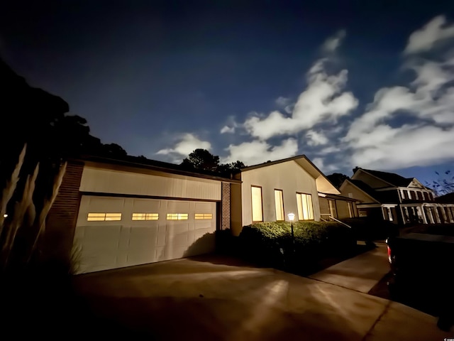 view of side of property with brick siding and stucco siding