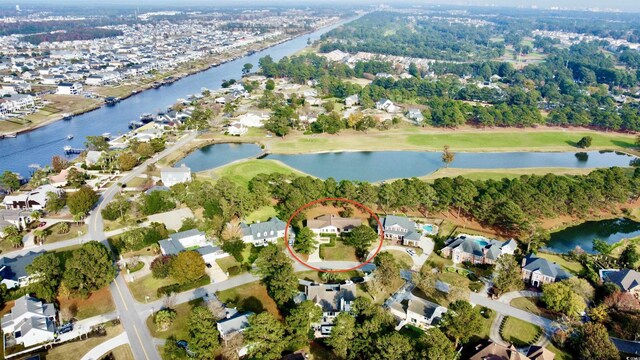 aerial view with a residential view and a water view