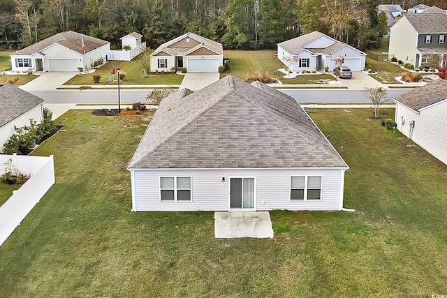 rear view of house with a garage