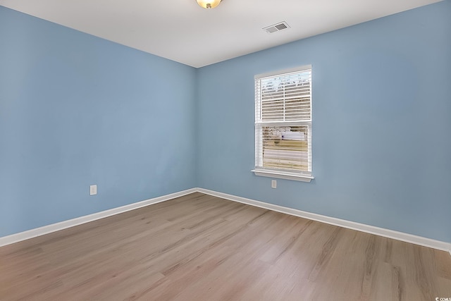 unfurnished room featuring light wood-type flooring