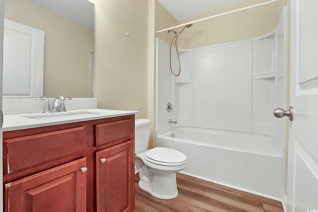 full bathroom featuring shower / bathing tub combination, toilet, vanity, and hardwood / wood-style flooring