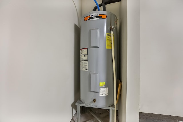 utility room featuring electric water heater