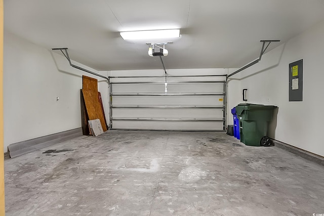 garage featuring electric panel and a garage door opener