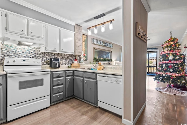 kitchen with extractor fan, white appliances, gray cabinets, white cabinets, and light wood-type flooring