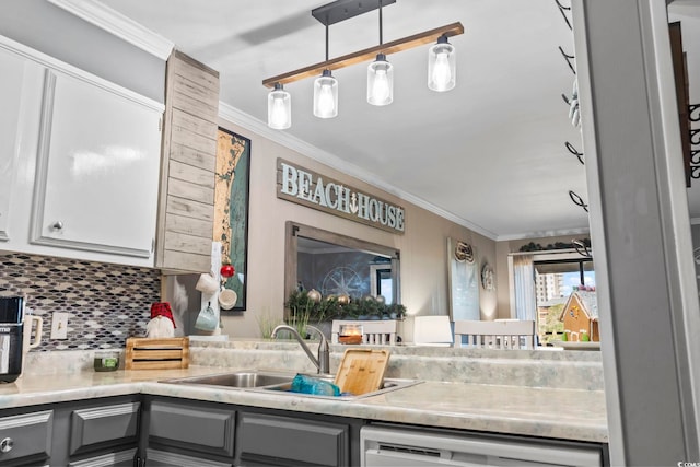 kitchen with decorative backsplash, decorative light fixtures, gray cabinetry, and sink