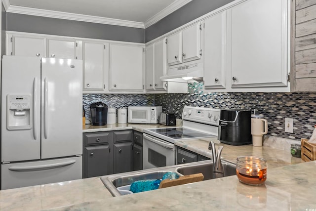 kitchen featuring white cabinetry, backsplash, white appliances, gray cabinets, and ornamental molding